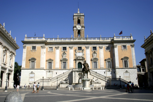 Milan, Lombardy, Italy - July 30, 2019: White Carrara marble sculpture celebrating Leonardo da Vinci by Pietro Magni in Piazza della Scala