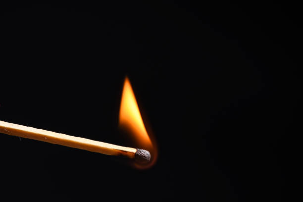 istock A gentle flame from a wooden match 926708088