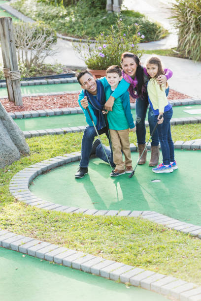 istock Family playing miniature golf 926723880