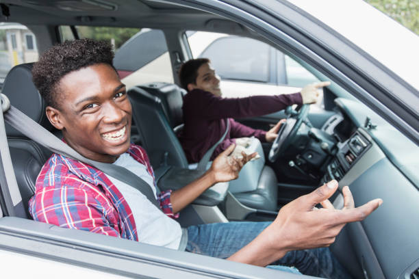 istock Amputee driving specially equipped car, with friend 926727494