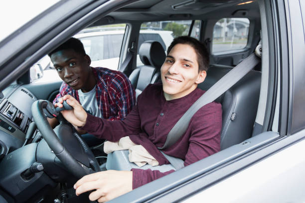 istock Amputee driving specially equipped car, with friend 926729652