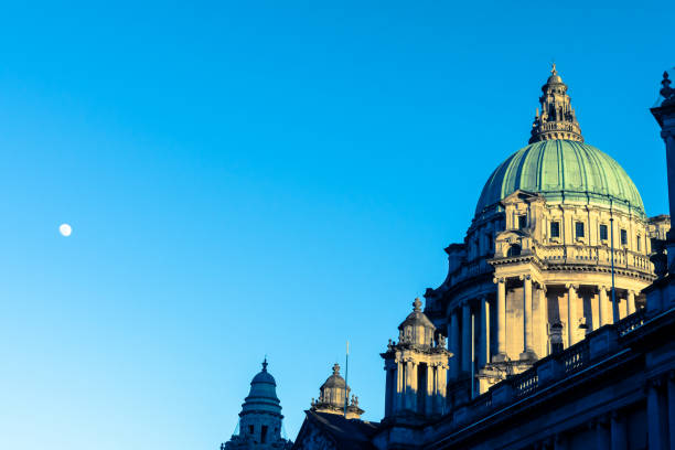 Cupola of neoclassical civic building at sunset with moon