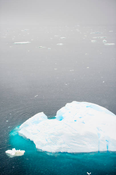 istock Iceberg  on blue ocean. Quiet, floe. 926731098