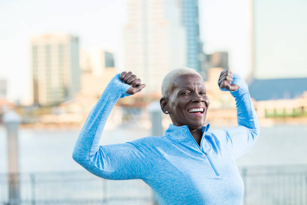 istock Senior African-American woman outdoors, stretching 926734722