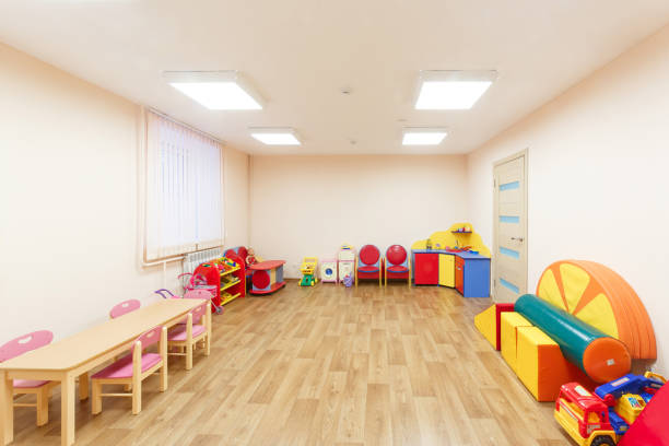 istock Spacious light pink colored game room with in the kindergarten 926738570
