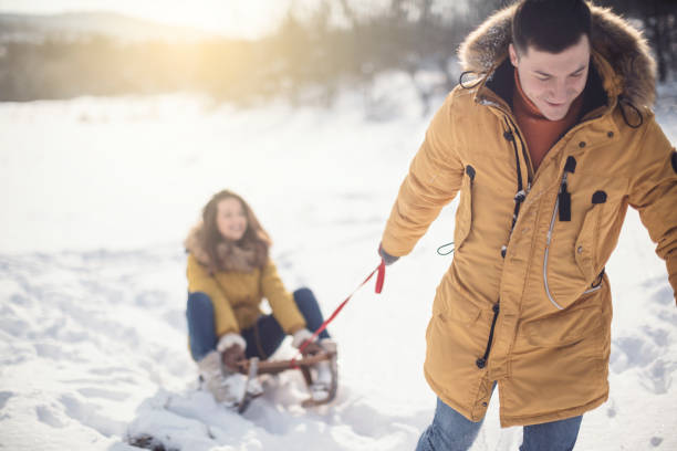 istock Love couple having fun on snow 926742128
