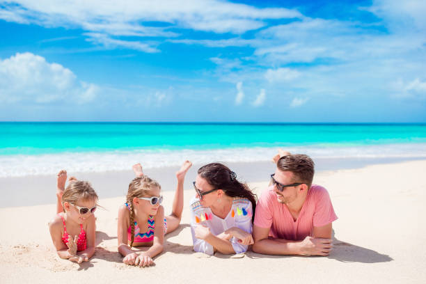 istock Happy beautiful family on white beach 926742616
