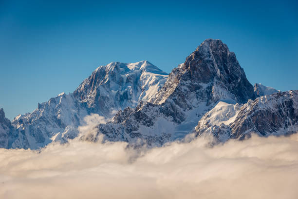 Mont Blanc above the clouds Mont Blanc and Grandes Jorasses above the winter clouds in the valley. mont blanc photos stock pictures, royalty-free photos & images
