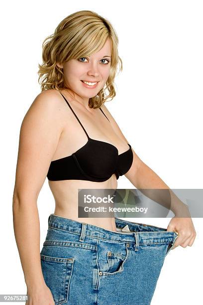 Smiling Weight Loss Girl Stock Photo - Download Image Now - Jeans, Large, One Woman Only