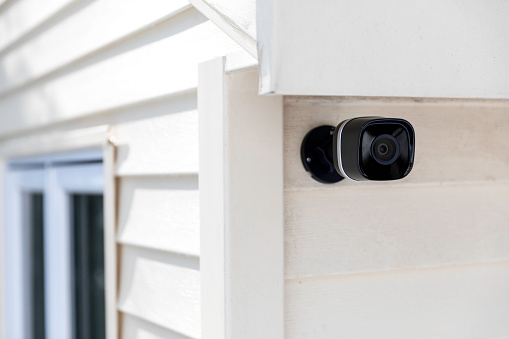 Black cctv outside the building, home security system