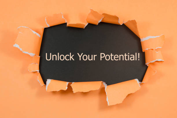 istock The text Unlock Your Potential appearing behind torn paper. 926757630