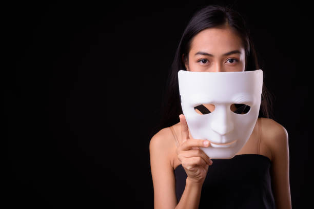 istock Young beautiful Asian woman against black background 926757728