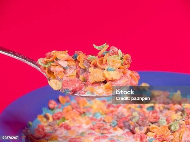Delicous Bite Of Fruity Cereal Stock Photo - Download Image Now - Pebble, Breakfast Cereal, Biting