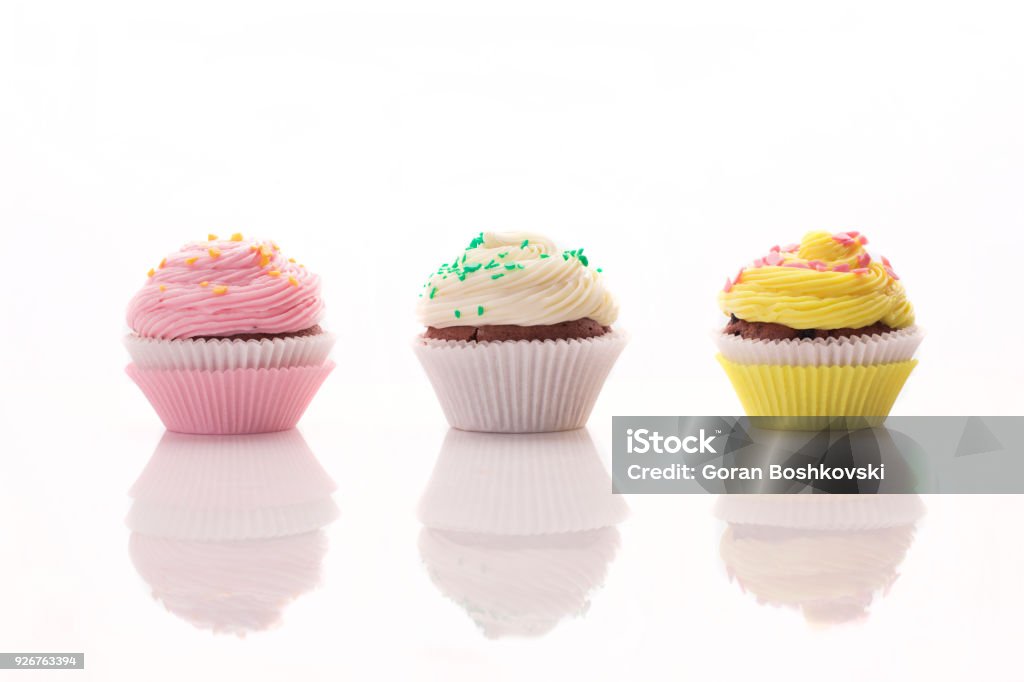 Three delicious muffins on a white background Cupcake Stock Photo