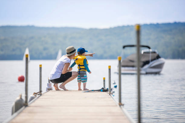 istock Mother and Son Looking at the View on Pier in Summer 926763796