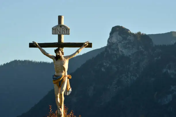 A crucifix seen near Oberammergau. Looming in the background is mount Kofel with an altitude of 1342 metres