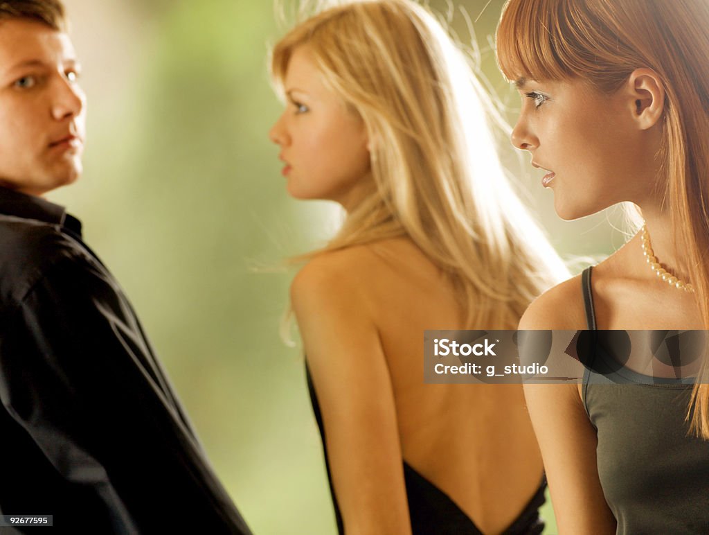 Three young people, outdoors  Adult Stock Photo