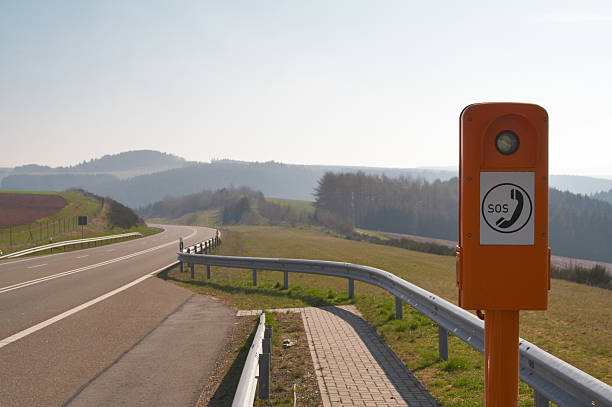 istock Emergency phone booth on a country road 92677774