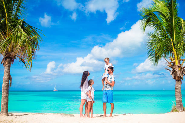 istock Happy beautiful family on white beach having fun 926777856
