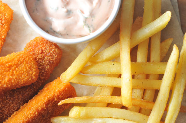 istock fried fish sticks with sauce with French fries 926778814