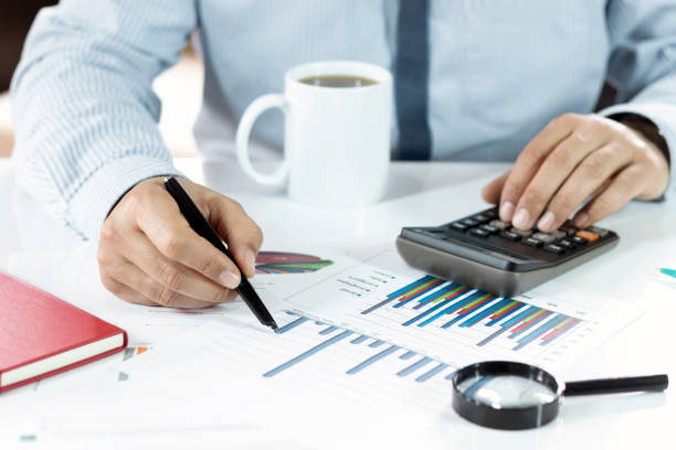 istock The Businessman is working and analysis graphics at office 926779430