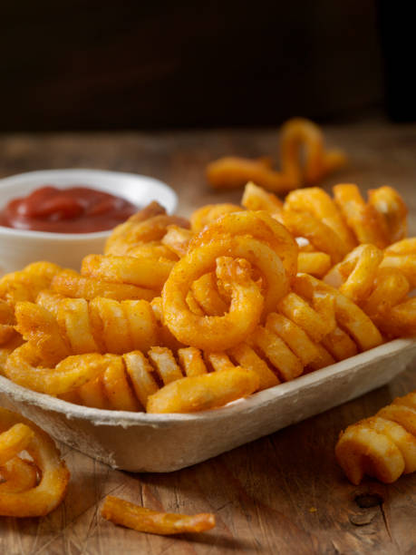 istock Spicy Curly Fries with Ketchup 926779538