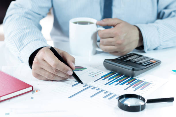 istock The Businessman is working and analysis graphics at office 926779668