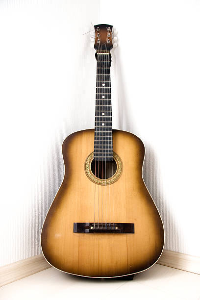 istock Guitar in a corner of room 92678025