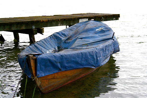 istock rowing boat moored by small wooden pier 92678195