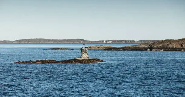 Stone Cairn, Norway. Traditional Scandinavian old navigation sea mark on rocks
