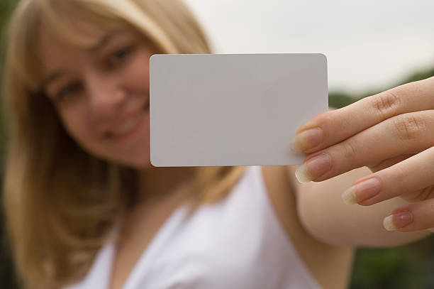 istock girl with a white card 92678970