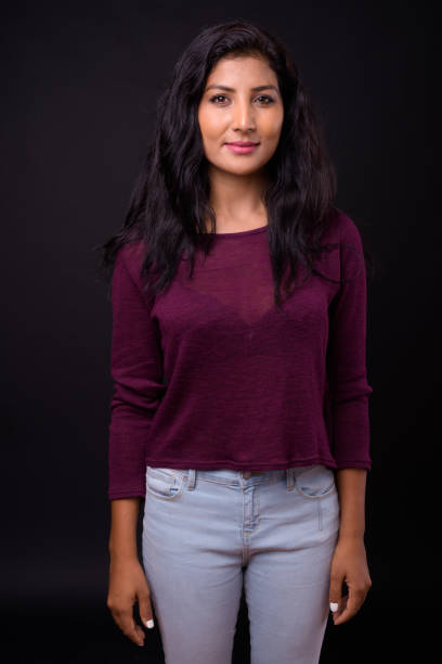 istock Young beautiful Indian woman against black background 926790588