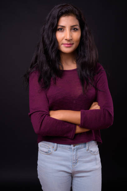 istock Young beautiful Indian woman against black background 926790598