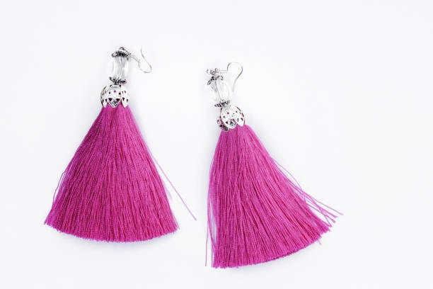 istock Pink handmade earrings on a white background. 926790604