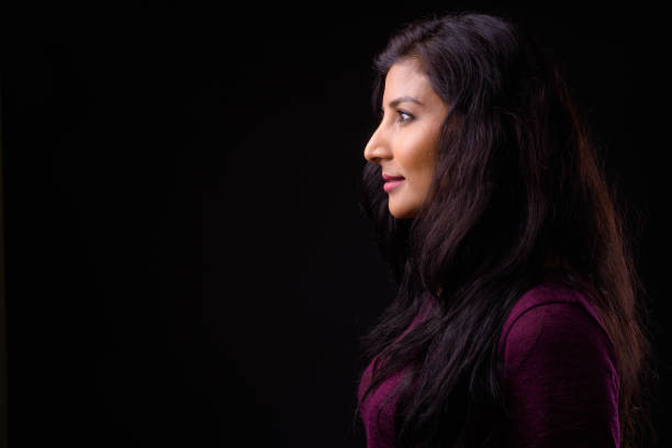 istock Young beautiful Indian woman against black background 926791046
