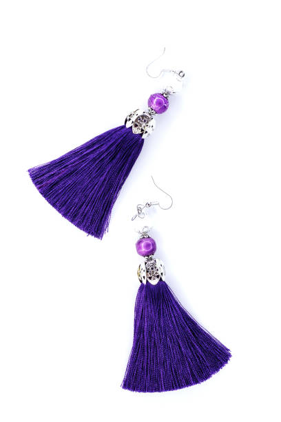 istock Purple handmade earrings on white 926791312