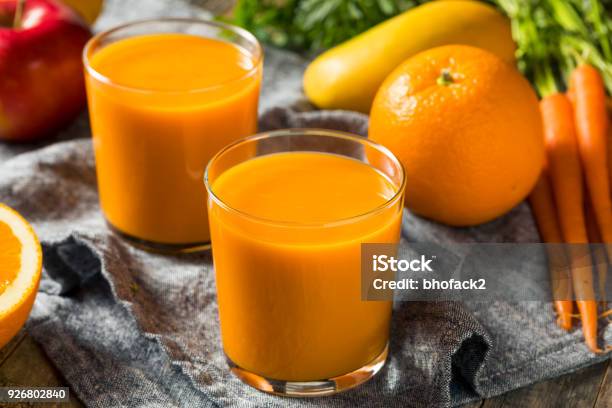 Healthy Organic Orange Carrot Smoothie Juice Drink Stock Photo - Download Image Now - Apple - Fruit, Backgrounds, Banana