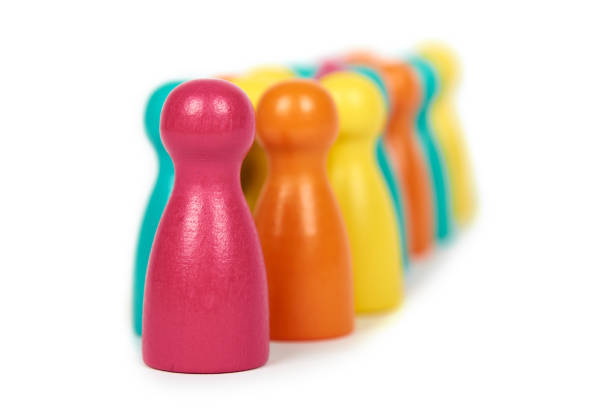istock Wooden pawn leisure game figures. Isolated on white background, social idea, immigrants problem. Togetherness 926810214