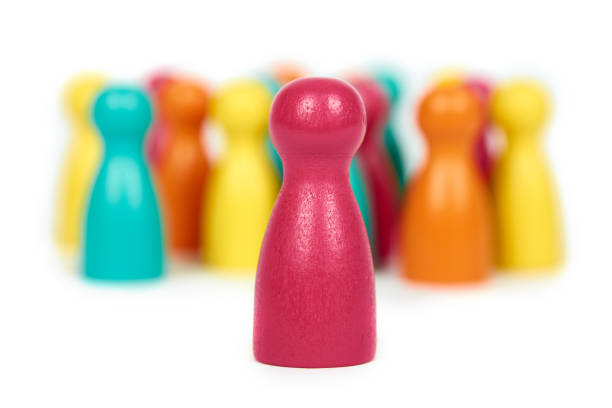 istock Wooden pawn leisure game figures. Isolated on white background, social idea, immigrants problem. Togetherness 926810216