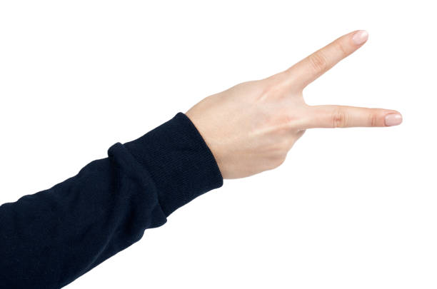 istock Female hand shows peace gesture and sign. Isolated on white background. Dark blue pullover 926810690