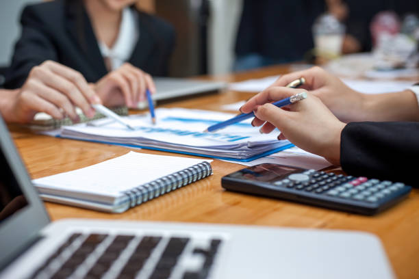 istock Teamwork process, business people working in the office discussing documents and ideas at meeting 926811424