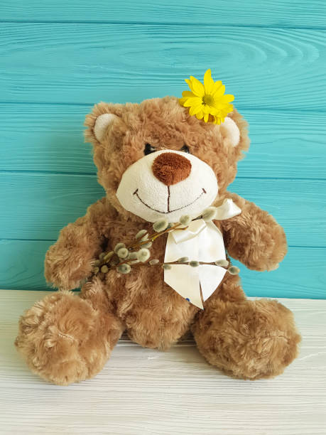 istock bear toy wooden background flower willow, spring 926816580