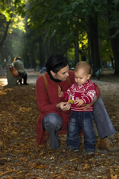 istock Family in the autumn park 92682087