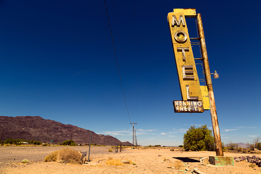 Vintage rusty motel sign on Route 66 in American desert land