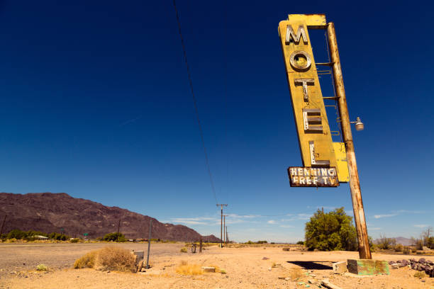 Motel sign on Route 66 in American desert land Vintage rusty motel sign on Route 66 in American desert land route 66 sign old road stock pictures, royalty-free photos & images