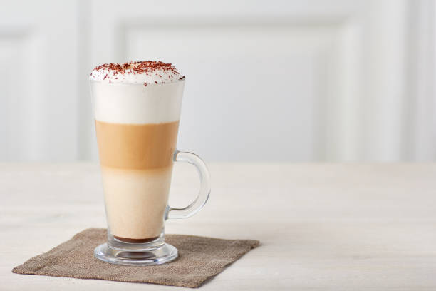 glass cup of coffee latte on wooden table - hot chocolate latté coffee cappuccino imagens e fotografias de stock