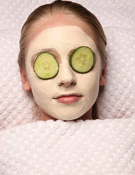 Spa treatment Girl enjoying spa treatment women facial mask mud cucumber stock pictures, royalty-free photos & images
