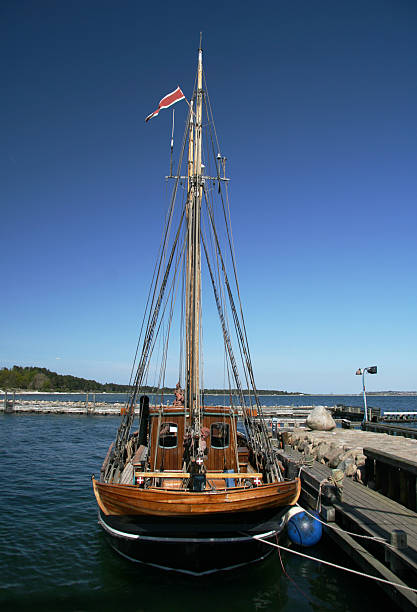 istock Old beautiful wooden sailboad in habour on summer day 92682582