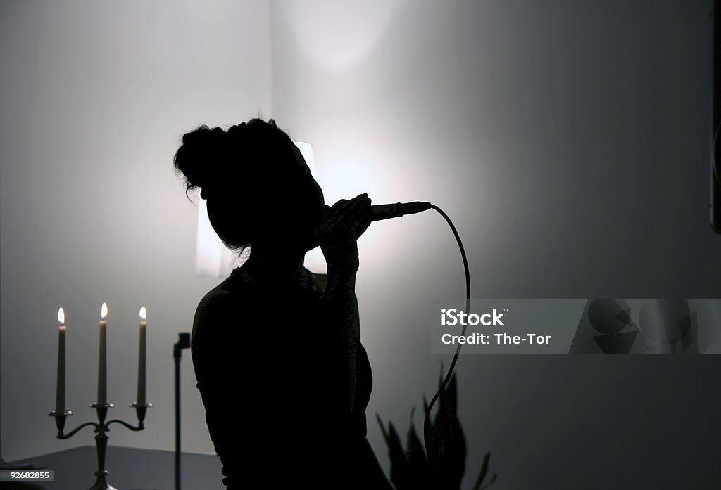 Singing in the Dark  In Silhouette Stock Photo