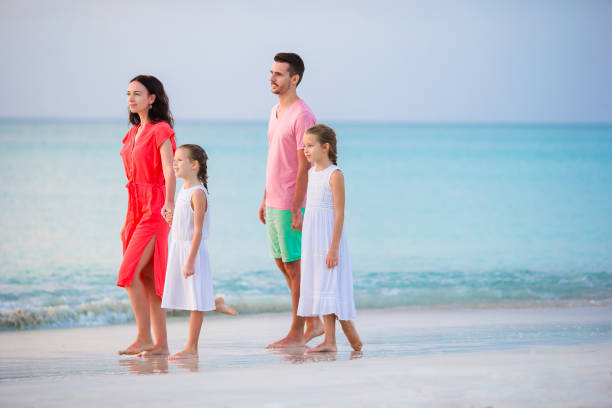 istock Happy beautiful family on a beach during summer vacation 926829248